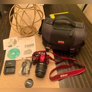 Nikon D3200 camera with case, cables, and instructional booklet/DVD's